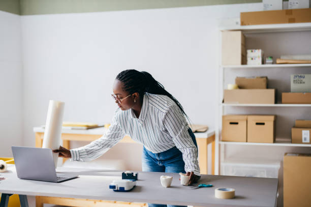istock Young Woman Working On Project In Modern Office Space 2156987531