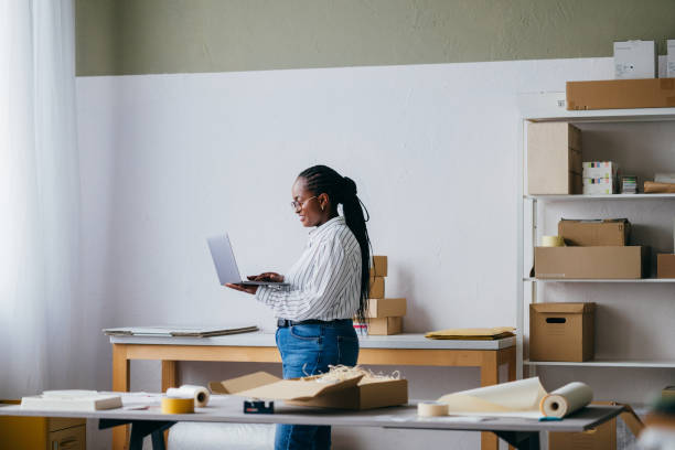 istock Young Woman Working on Laptop in a Modern Office Space 2156987612