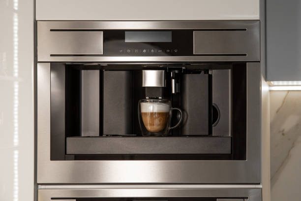 istock Integrated built-in coffee machine making cappuccino in glass cup 2156988567