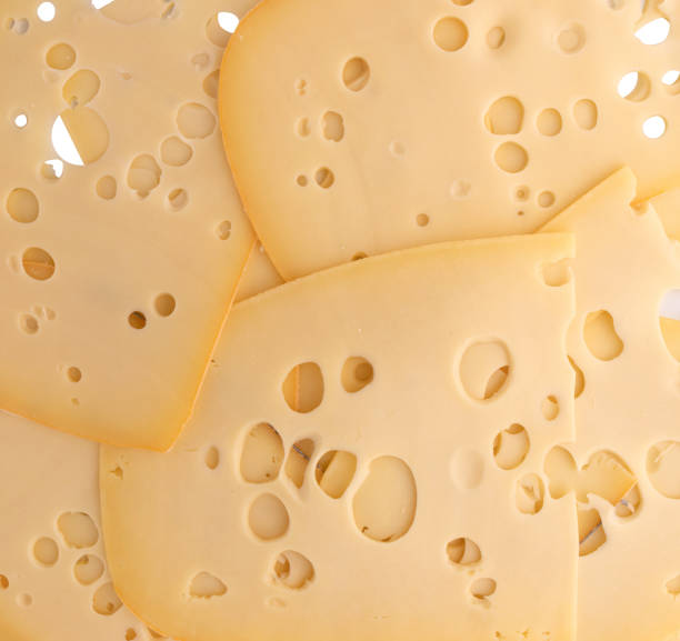 istock pieces of sliced cheese as background 2156991317