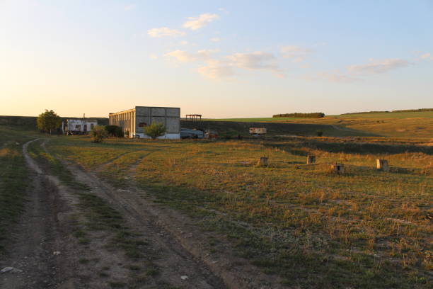 istock A dirt road leading to a farm 2156992690