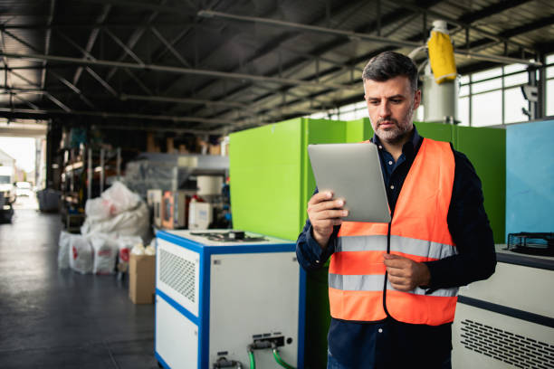 istock Manager from the factory coordinating the manufacturing process 2156992970