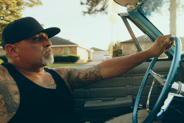 istock Mature Man Crusing in a Vintage Lowrider Convertible Car 2156995918