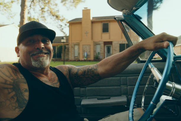 istock Mature Man Crusing in a Vintage Lowrider Convertible Car 2156995942
