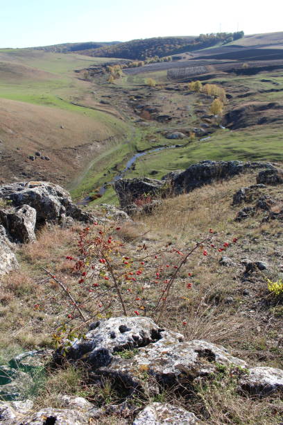 istock A landscape with a rocky hill and a valley in the background 2157004853