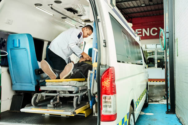 Portrait of mid adult paramedic man on accident