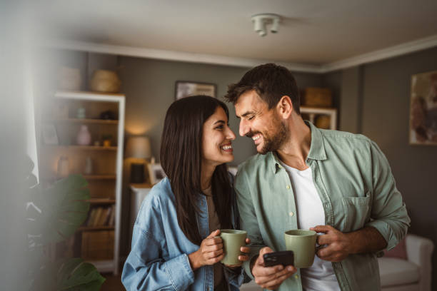 istock Couple use mobile phone for text message or browse internet at home 2157007849