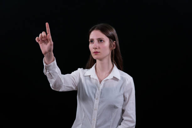Young woman touching digital screen, Success is right at your fingertips.