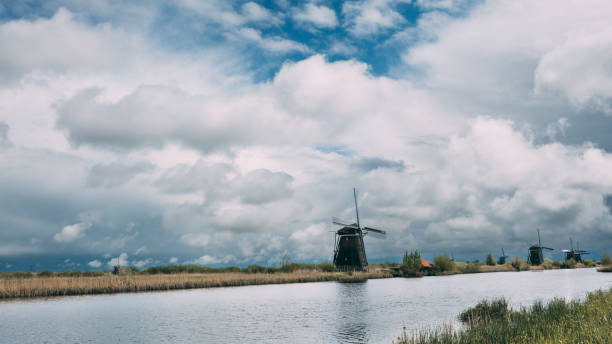 Dutch Windmills on Water in Kinderdijk, The Netherlands