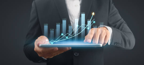 istock Businessman plan graph growth and increase of chart positive indicators,tablet in hand 2157013147