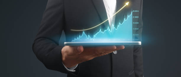 istock Businessman plan graph growth and increase of chart positive indicators,tablet in hand 2157013150