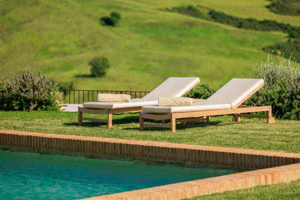 istock Pool deck chair with a Tuscan countryside landscape 2157014856
