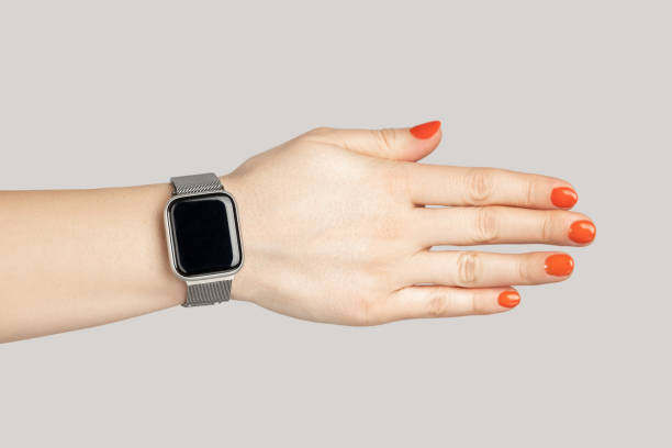 istock Woman hand with smartwatch with empty display handshaking with partner. 2157015195