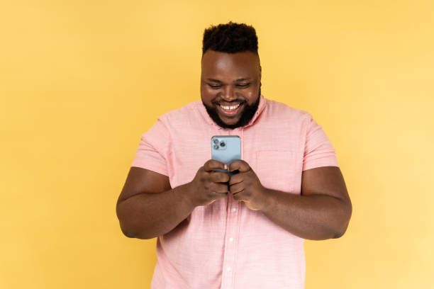 istock Man using mobile phone with happy expression, addicted to smartphone, texting in social network. 2157015336