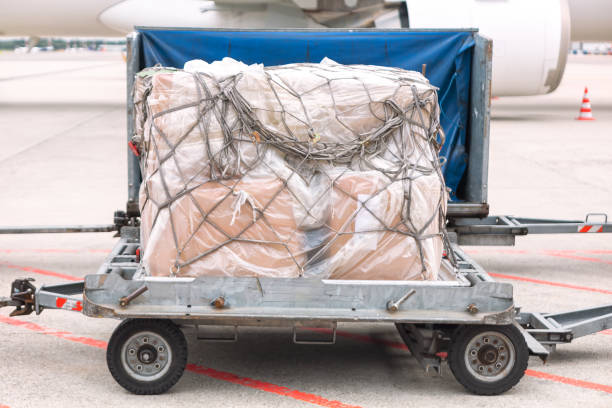 istock Luggage Cart on the Runway 2157015720