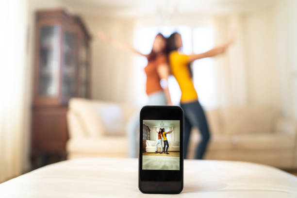 istock Two friends recording a dancing selfie 2157015796