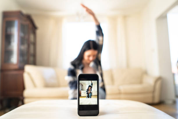 istock Woman dancing in front of her camera phone 2157015801