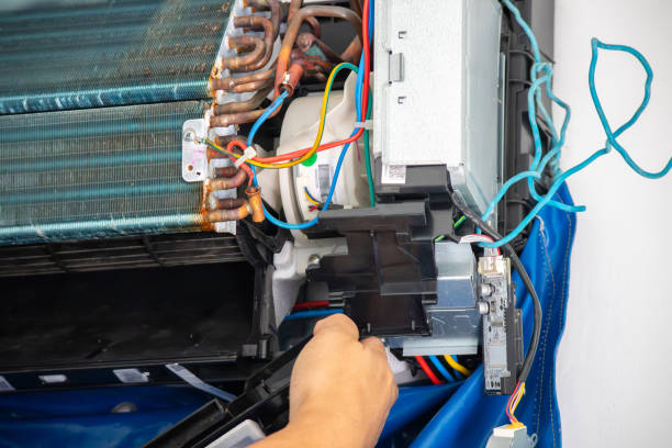 istock technician repair air conditioner maintenance service 2157015872