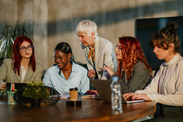 istock Interracial female businesswomen working on startup project with mentor 2157016225