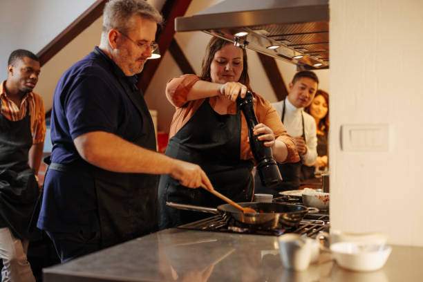 istock Woman helping chef cook 2157016611