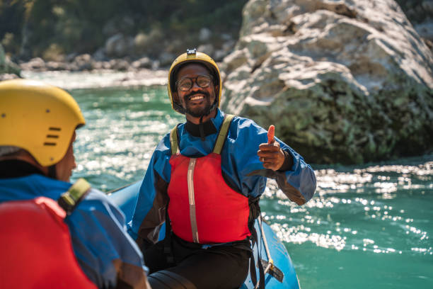 Diverse Outdoor Enthusiasts Enjoying a Sunny Rafting Day