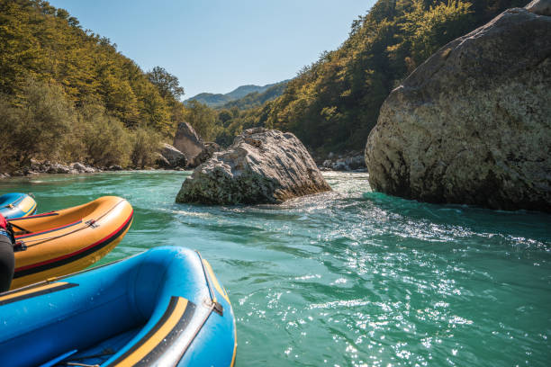 istock Serene River Rafting Scene with Inflatable Rafts and Boulders 2157018059