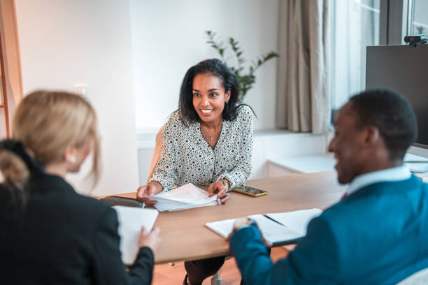 istock Hispanic Businesswoman Sharing Insights with Team 2157018553