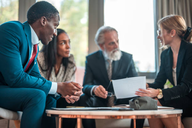 istock Focused Discussion Among Diverse Executives in Small Meeting Space 2157018555