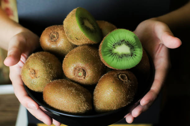 istock Kiwi fruit on dark background. Green Healthy organic fruit concept. 2157019475