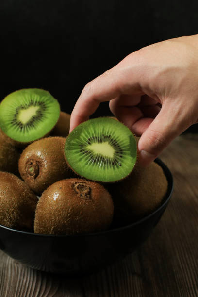 istock Kiwi fruit on dark background. Green Healthy organic fruit concept. 2157019483