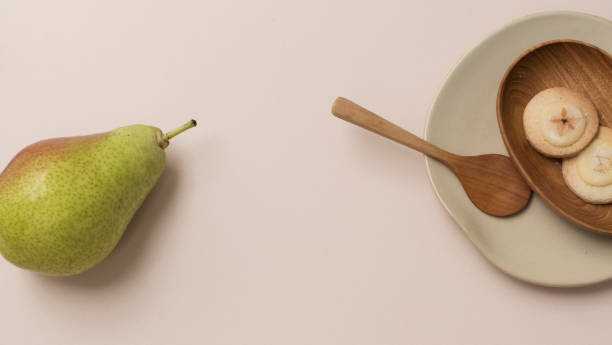 istock A pear and cookies on the table 2157021614