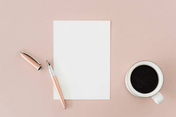 istock Pen paper and coffee on the table 2157021663