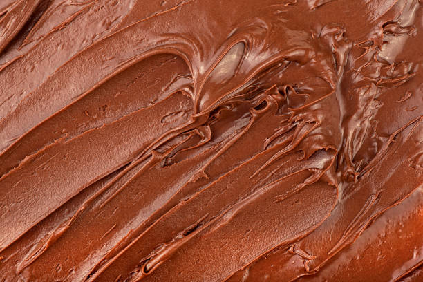 istock Melted chocolate cream as background, top view. Hazelnut cream, chocolate smear. 2157024203