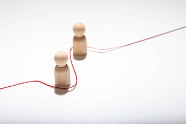 The red human figure is connected by lines with three persons. Business management and giving orders to staff. Leadership, teamwork. Cooperation and collaboration. Shares experiences and information.