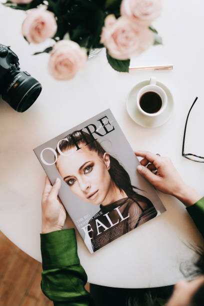 Woman reading a magazine in a cafe