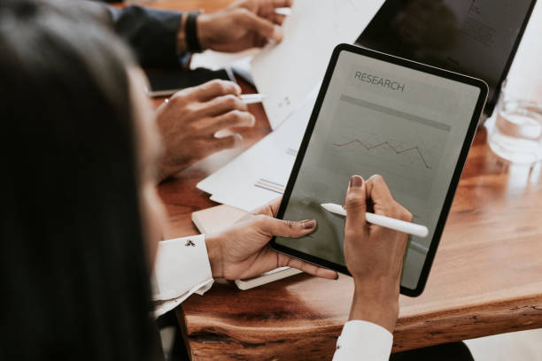 istock Businessperson taking note on a digital tablet 2157026594