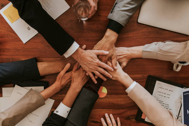 istock Business people stacking their hands together 2157026662