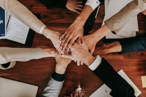 istock Business people stacking their hands together 2157026664
