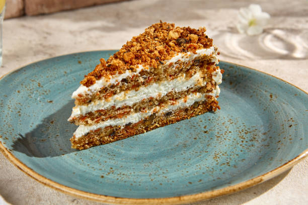 istock Authentic Carrot Cake Slice in Sunlit Still Life Setting with Natural Textures 2157026946