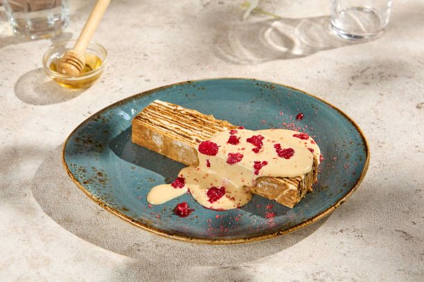 istock Authentic Medovik Dessert with Sauce in Natural Sunlight Still Life Setting 2157026953