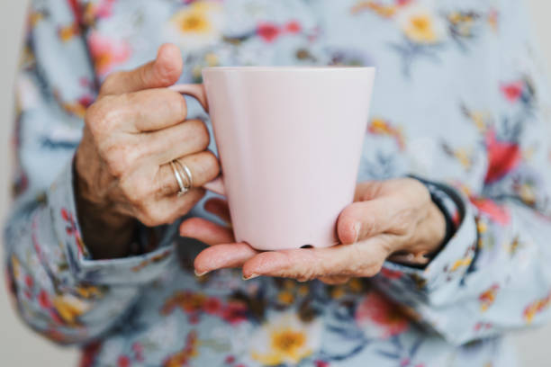 Woman holding a pink mug