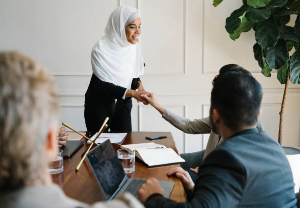 istock Happy diverse business people making a deal 2157031080