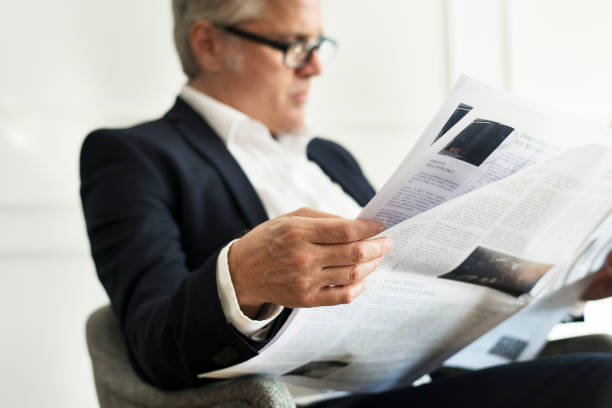 istock Senior businessman reading a newspaper 2157031190