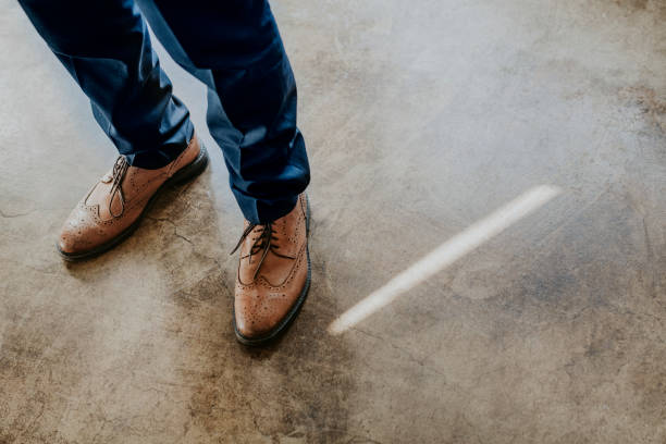 istock Businessman wearing a brown leather shoes 2157031202