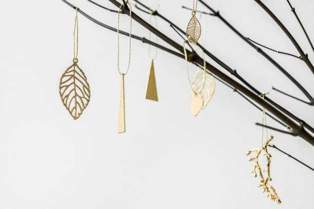 istock Festive golden Christmas ornaments on a branch 2157031714