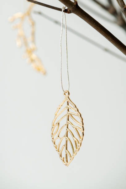 istock Festive golden Christmas ornaments on a branch 2157031733
