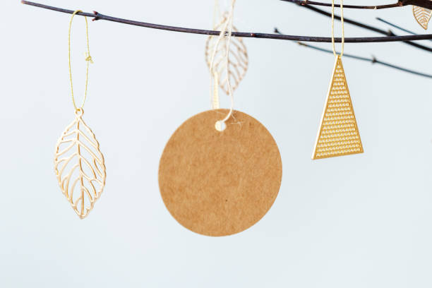istock Festive golden Christmas ornaments on a branch 2157032008