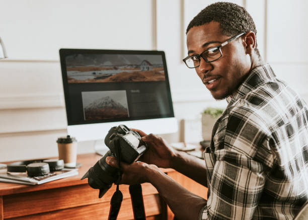 istock Black photographer working on his desk 2157032209