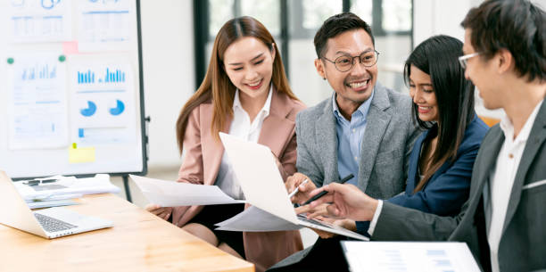 istock Happy multiracial coworkers have fun cooperating working together at office meeting, teamwork concept 2157032233