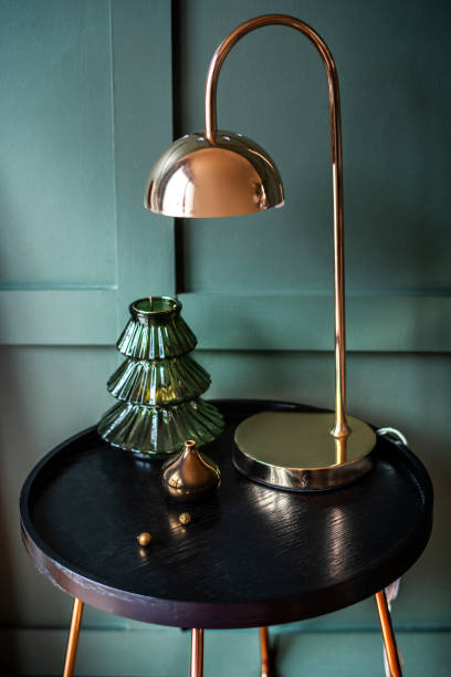 istock Rose gold shiny lamp on a table with Christmas ornaments 2157032351